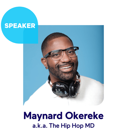 Smiling man with glasses and headphones in front of a blue background.