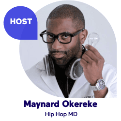 Person in glasses holding a lightbulb, wearing headphones and a lab coat.