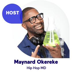 Smiling man with glasses holding a beaker and wearing headphones