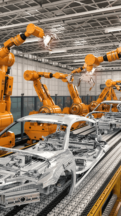 Automated robotic arms assembling car frames in a factory.