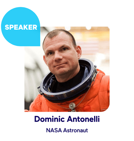 Man in an orange NASA astronaut suit with a helmet collar, labeled as a speaker.