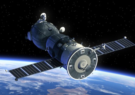 Satellite orbiting Earth with solar panels extended