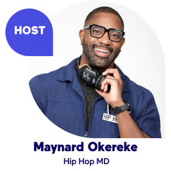 Man in glasses smiling, wearing a blue jacket labeled Hip Hop MD.
