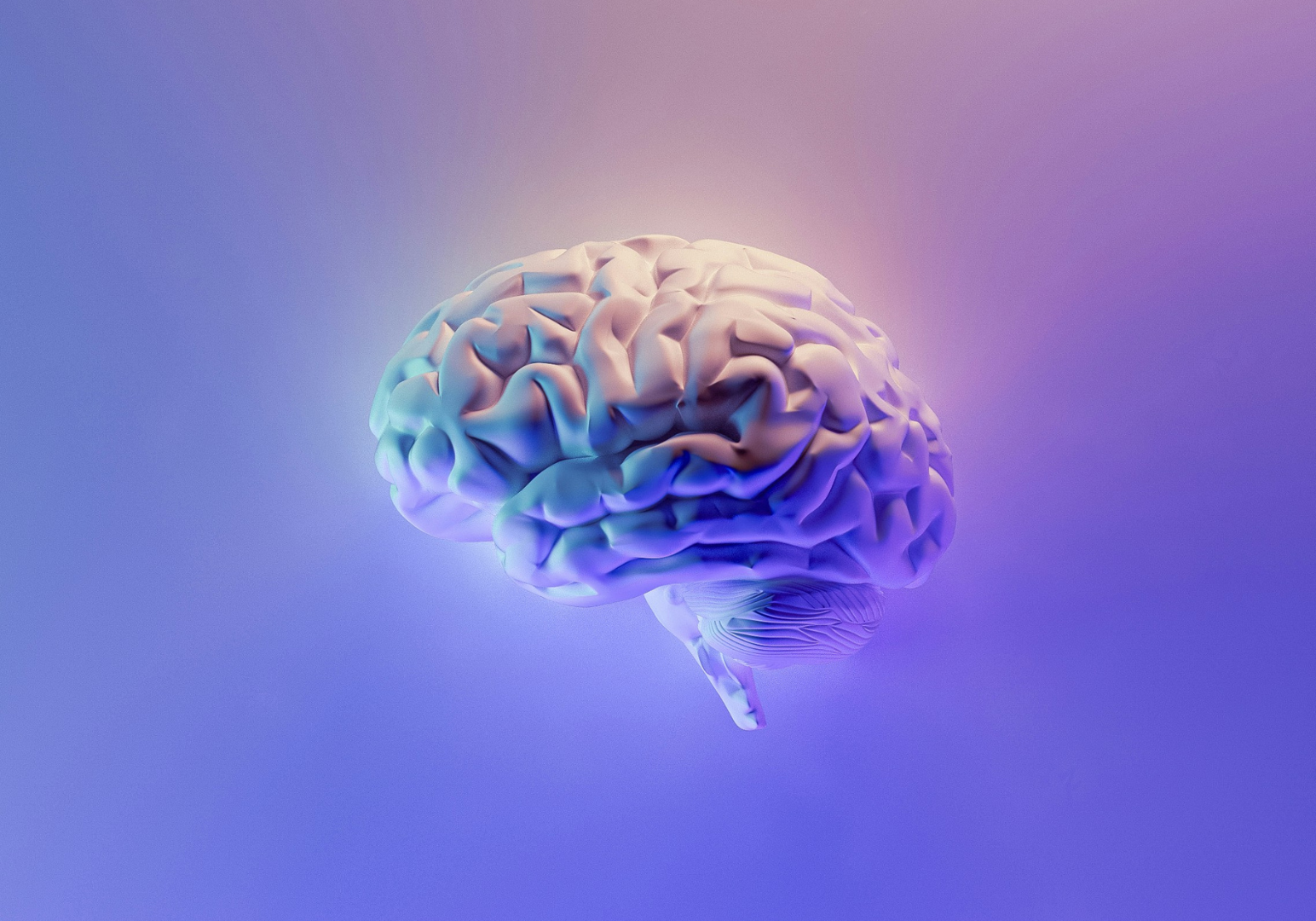 Illustration of a human brain with glowing colors on a gradient background.