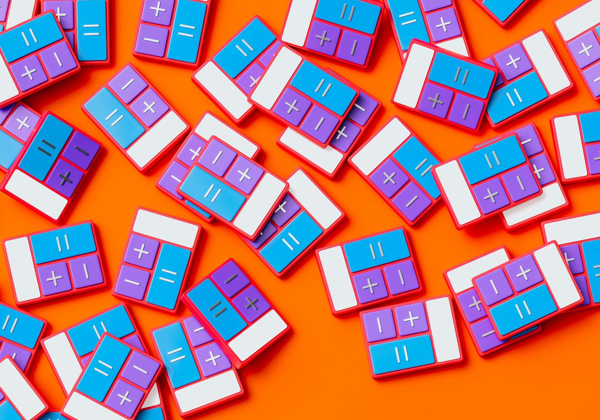 Miniature calculators scattered across an orange surface.